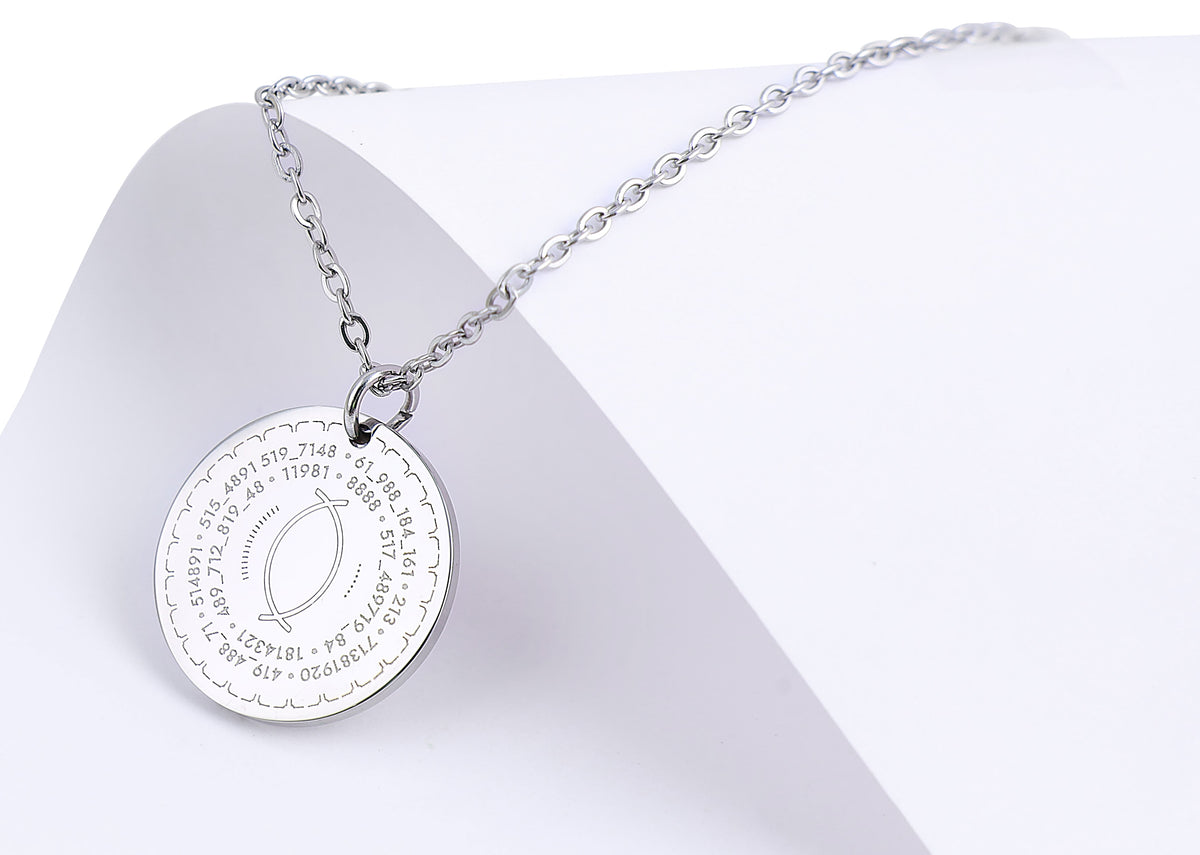 Silver necklace with a round pendant on a white background
