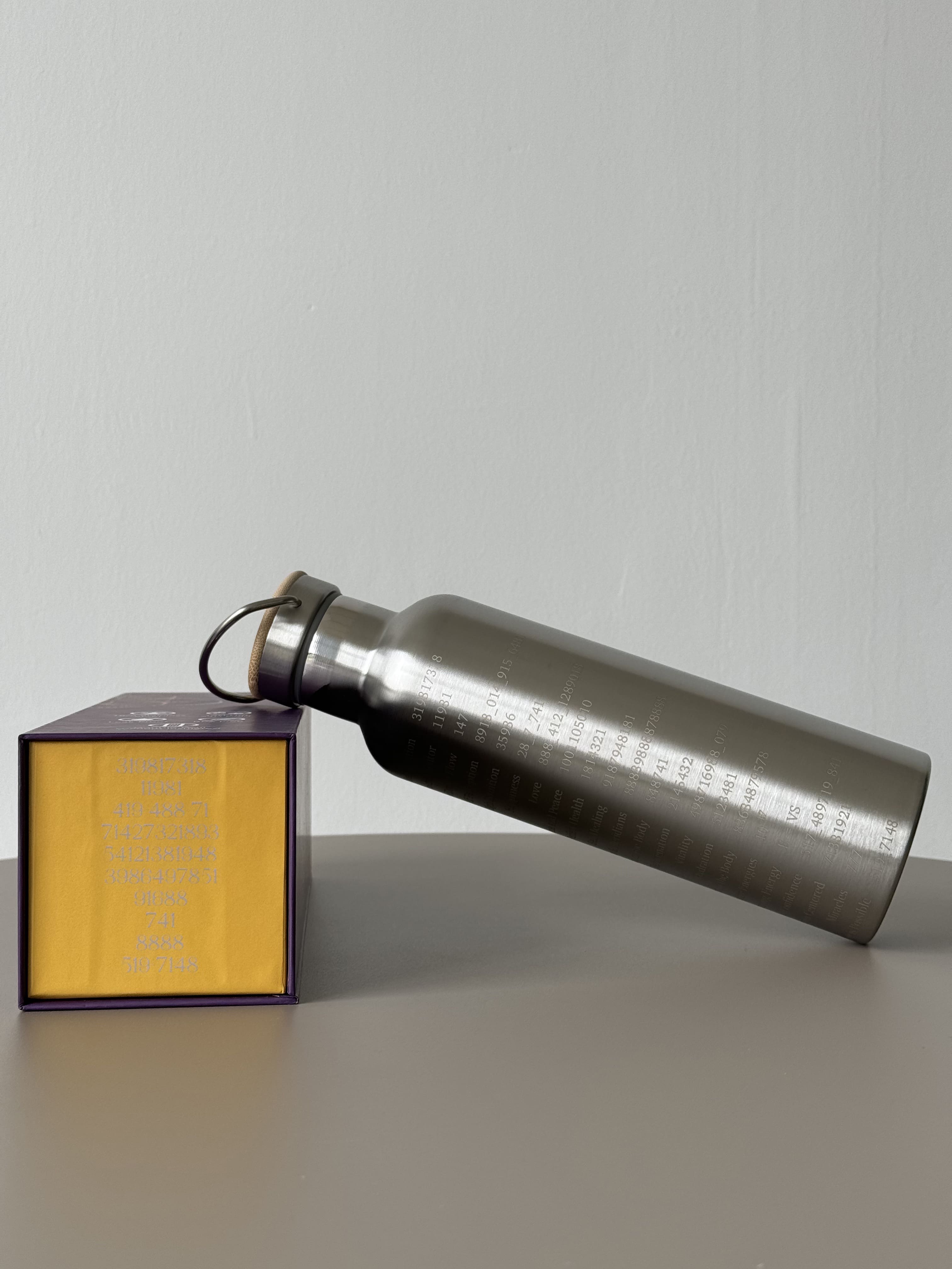 750ml double-walled stainless steel bottle with Grabovoi codes to transform water and align the body with high frequencies.