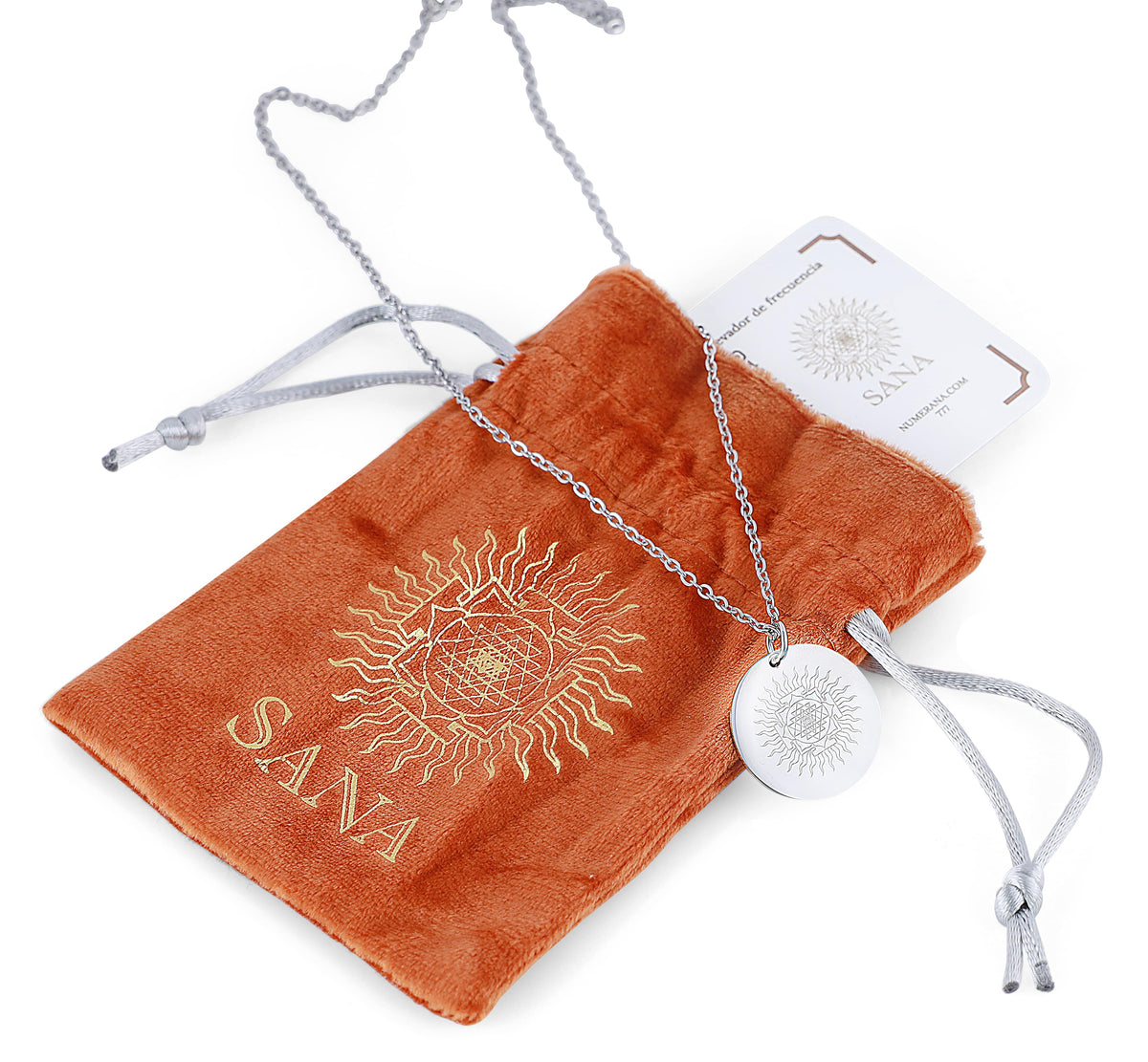 Silver necklace with a pendant on an orange cloth with &